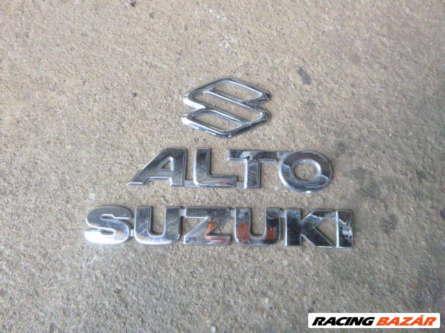 Suzuki Alto (5th gen) 2005 csomagtérajtó embléma  1. kép