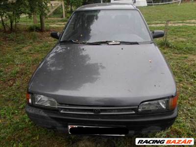 MAZDA 323 -94 Bal fényszóró alatti bajusz díszléc