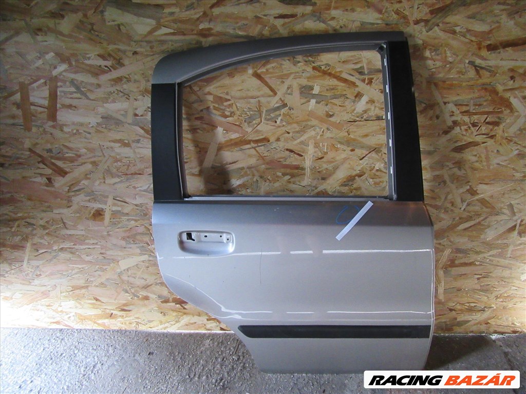 Ajtó36020 Fiat Panda II. ezüst színű, jobb hátsó ajtó a képen látható sérüléssel 1. kép