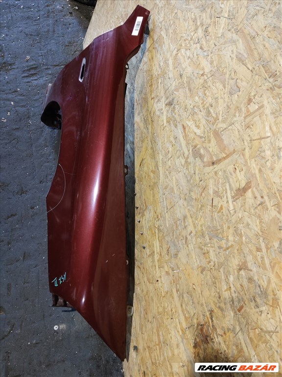 157759 Alfa Romeo 147 2005-2010 bordó színű jobb első sárvédő a képen látható sérüléssel 3. kép