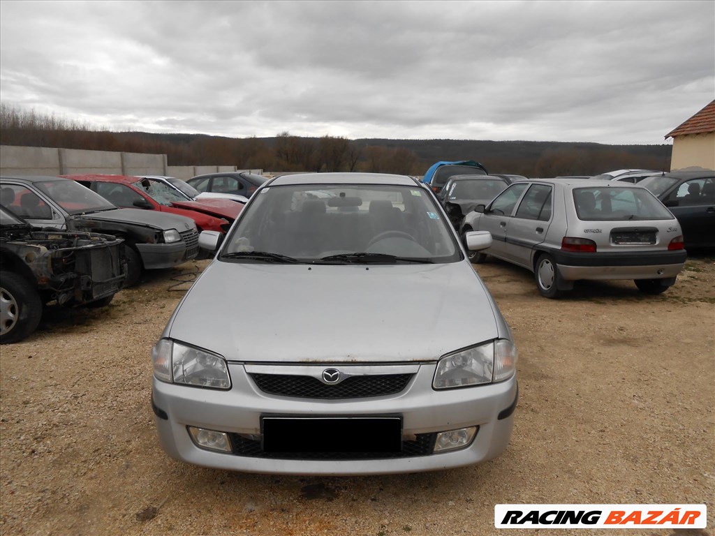 Mazda 323 S VI (BJ) 2.0 TD jobb első féknyereg 1. kép