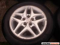  5x114.3 16" gyári Chrysler alufelni, rajta 225/55 használt Continental nyári gumi 