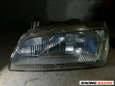 Suzuki Swift II Fényszóró Bal "058310"