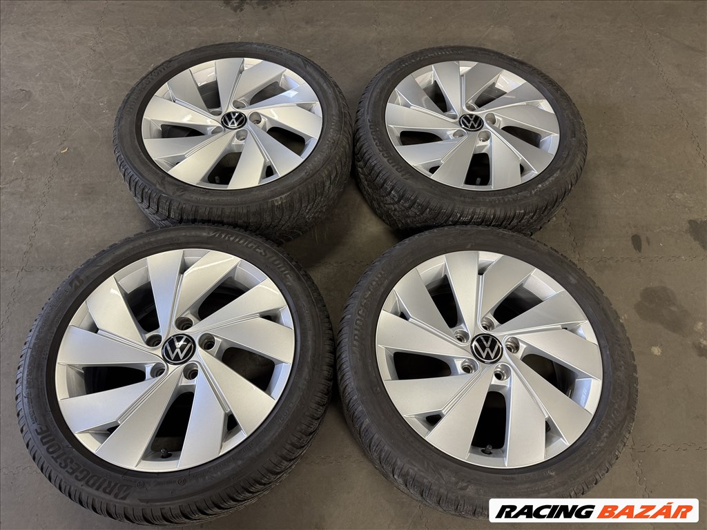 5x112 lyukosztású 17" újszerű (gyári felni) alufelni, rajta 205/50 használt Bridgestone téli gumi  1. kép