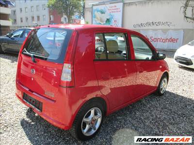 Daihatsu Cuore 2003---> hátsó lökhárító ezüst és piros