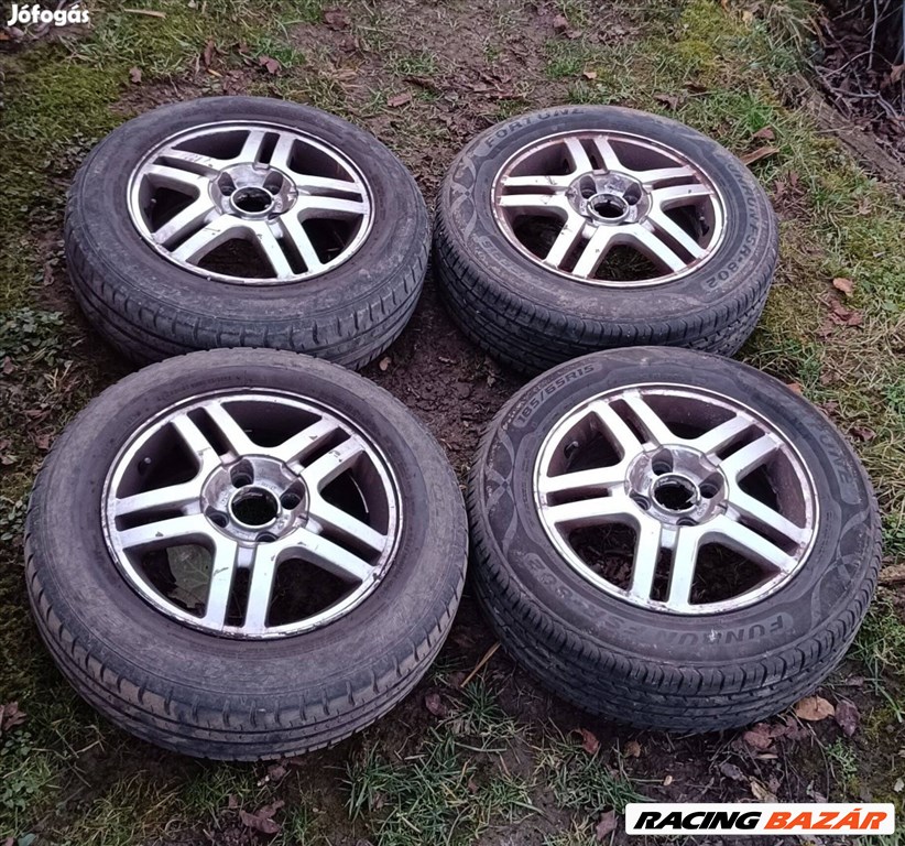  4x108 lyukosztású 15" használt (gyári felni) alufelni, rajta 185/65 használt nyári gumi gumi  8. kép