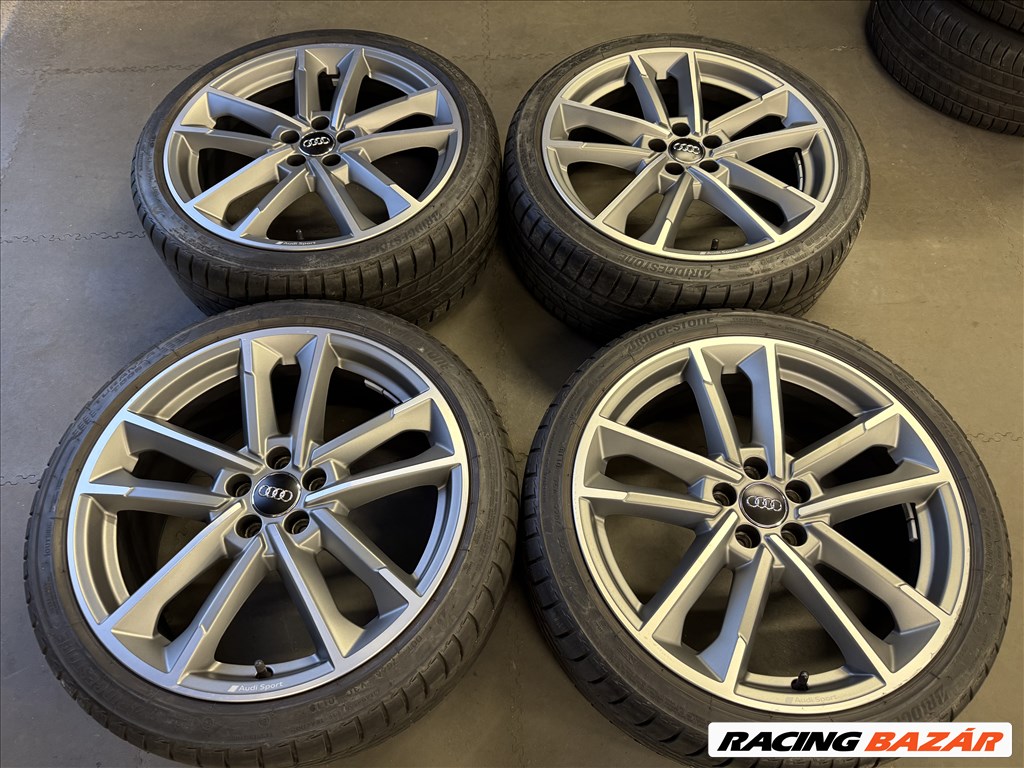  5x100 lyukosztású 18" újszerű (gyári felni) alufelni, rajta 215/40 újszerű Bridgestone nyári gumi 1. kép