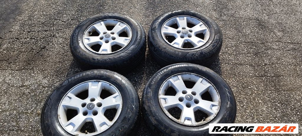  5x114.3 lyukosztású 16" Ford Maverick gyári alufelni, 215/70 Hankook nyári gumival eladó! 5l84-1007 1. kép