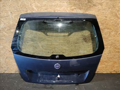 157555 Fiat Stilo 3 ajtós kék színű csomagtérajtó, a képen látható sérüléssel, fúrt üveggel!! 46751763