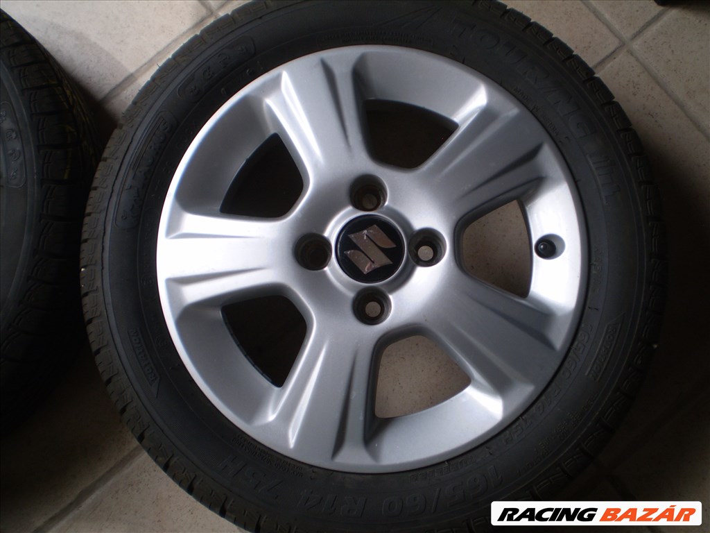  4x100 lyukosztású 14" újszerű alufelni, rajta 165/60 újszerű Taurus nyári gumi 2. kép
