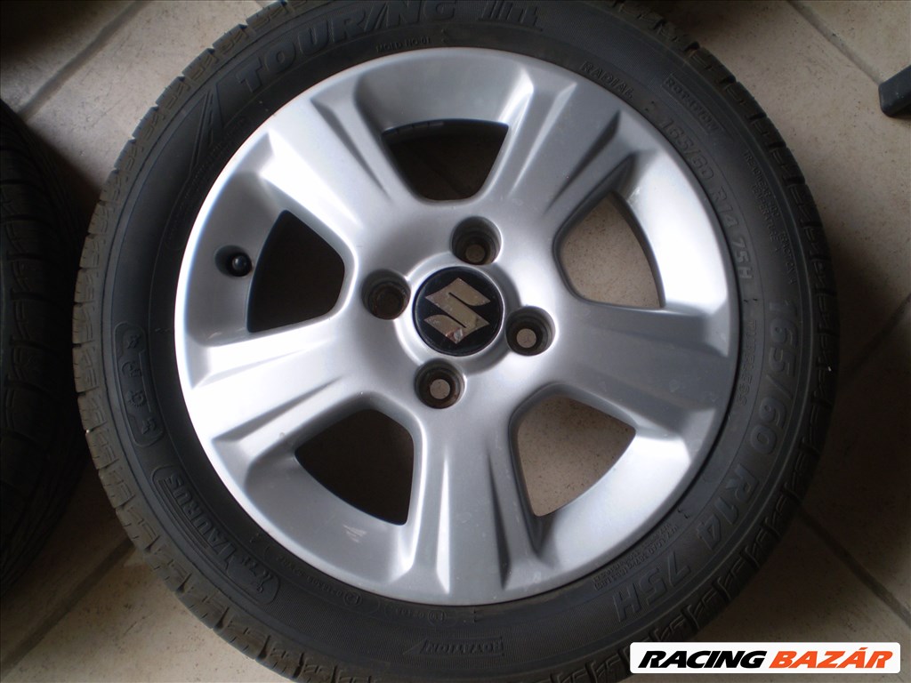 4x100 lyukosztású 14" újszerű alufelni, rajta 165/60 újszerű Taurus nyári gumi 4. kép