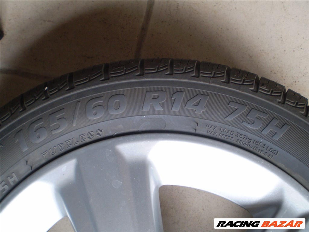  4x100 lyukosztású 14" újszerű alufelni, rajta 165/60 újszerű Taurus nyári gumi 9. kép