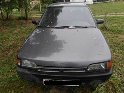 MAZDA 323 -94 Bal fényszóró alatti bajusz díszléc