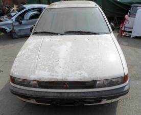 MITSUBISHI LANCER 88-92 BAL ELSŐ FÉNYSZORÓ