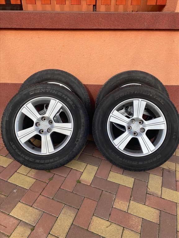  5x100 lyukosztású 16" használt Subaru alufelnik, rajtuk 215/65 használt Continental nyári gumik 1. kép