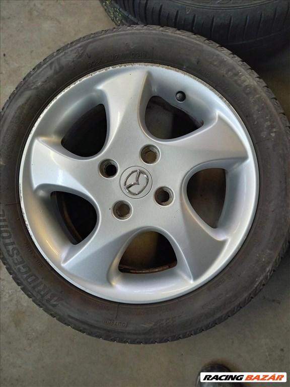 Mazda2 4x108-as 6x15" újszerű (gyári felni) alufelni, 195/50 újszerű Falken nyári gumi sxx3  3. kép