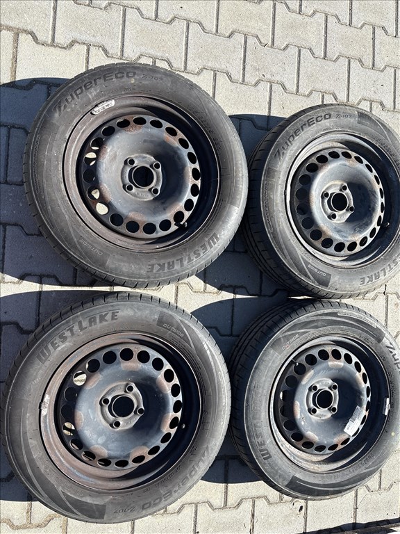 Opel Corsa d/e 4x100 lyukosztású 15" használt gyári felni lemezfelni,rajta 185/65 nyári gumi 1. kép