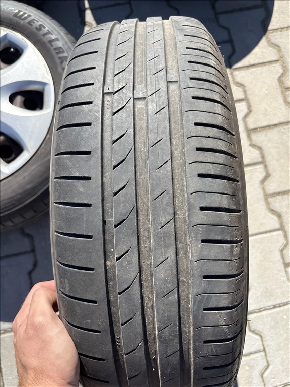 Opel Corsa d/e 4x100 lyukosztású 15" használt gyári felni lemezfelni,rajta 185/65 nyári gumi 5. kép