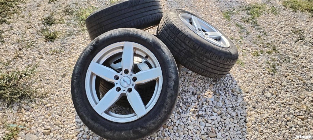  5x120 lyukosztású 17" használt Dezent alufelni, rajta kopott gumi  1. kép