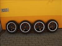 4x100 lyukosztású 14" használt Titan alufelni, rajta 165/60 használt Firestone nyári gumi gumi