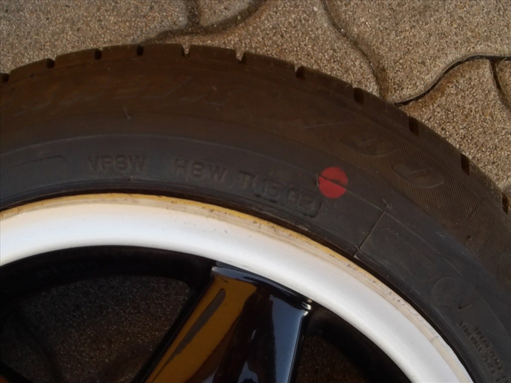  4x100 lyukosztású 14" használt Titan alufelni, rajta 165/60 használt Firestone nyári gumi gumi  3. kép