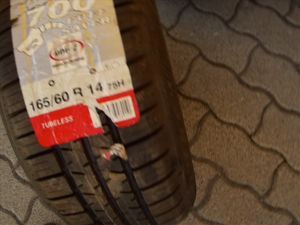  4x100 lyukosztású 14" használt Titan alufelni, rajta 165/60 használt Firestone nyári gumi gumi  4. kép