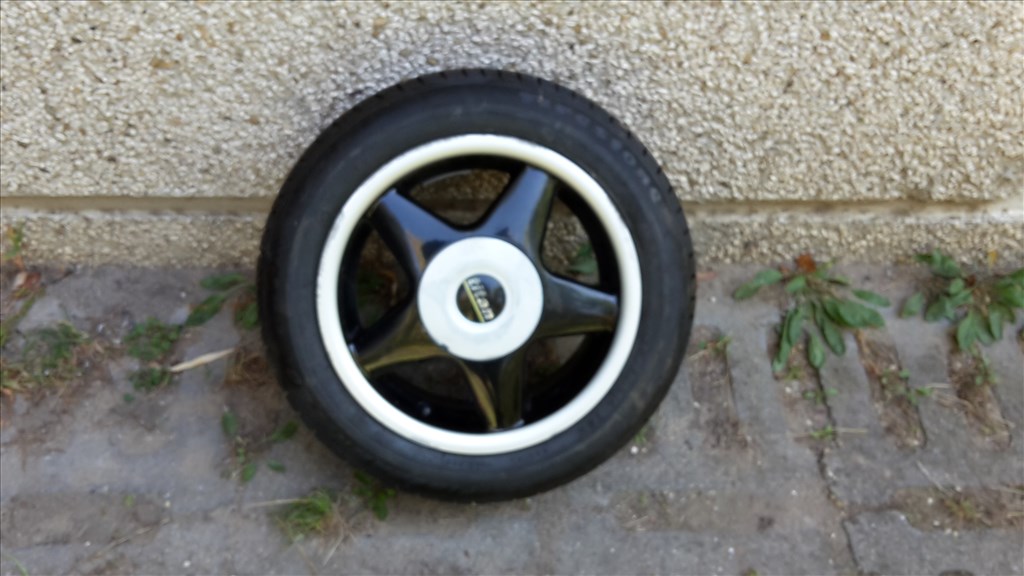  4x100 lyukosztású 14" használt Titan alufelni, rajta 165/60 használt Firestone nyári gumi gumi  7. kép