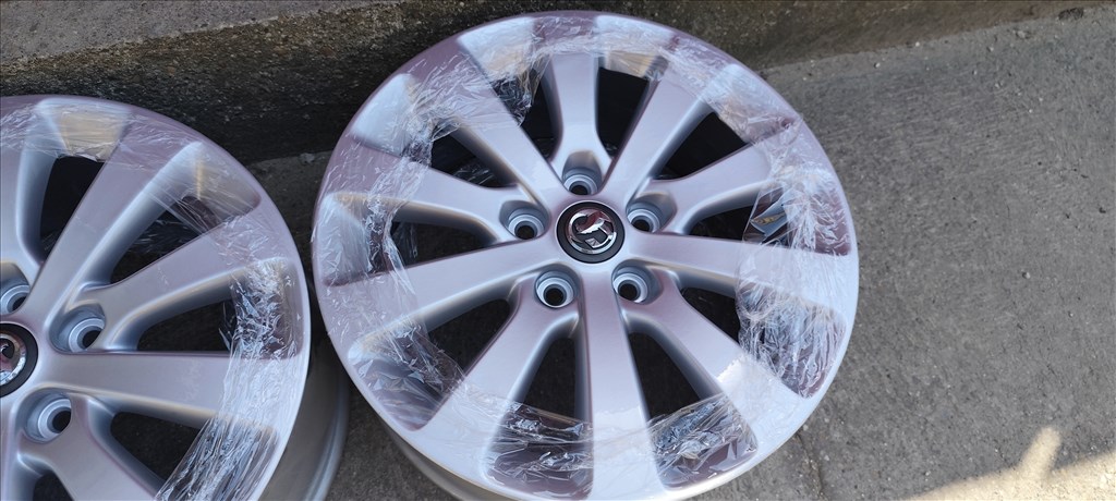 5x115 Opel gyári 17" alufelni garnitúra, ET44, 7J. FRISSEN SZINTEREZETT EZÜST 5. kép