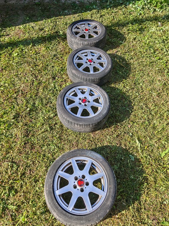  5x100 lyukosztású 15" használt Aez alufelni, rajta 195/50 használt nyári gumi gumi  1. kép