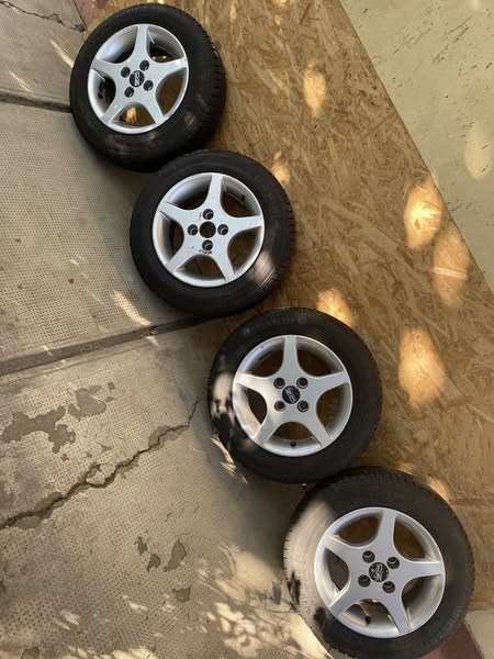  4x98 lyukosztású 13" használt OZ alufelni, rajta 155/70 használt Barum nyári gumi gumi  1. kép