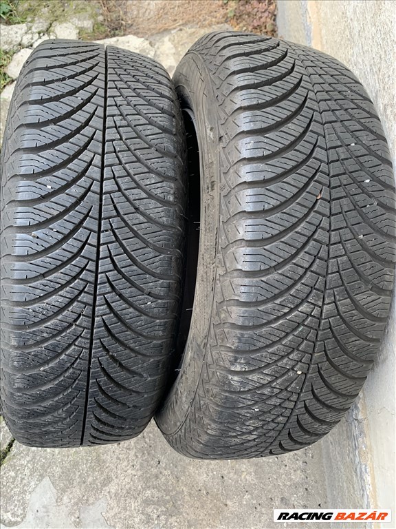  4x98 lyukosztású 14" használt lemezfelni, rajta 185/65 újszerű Goodyear négyévszakos gumi gumi  1. kép