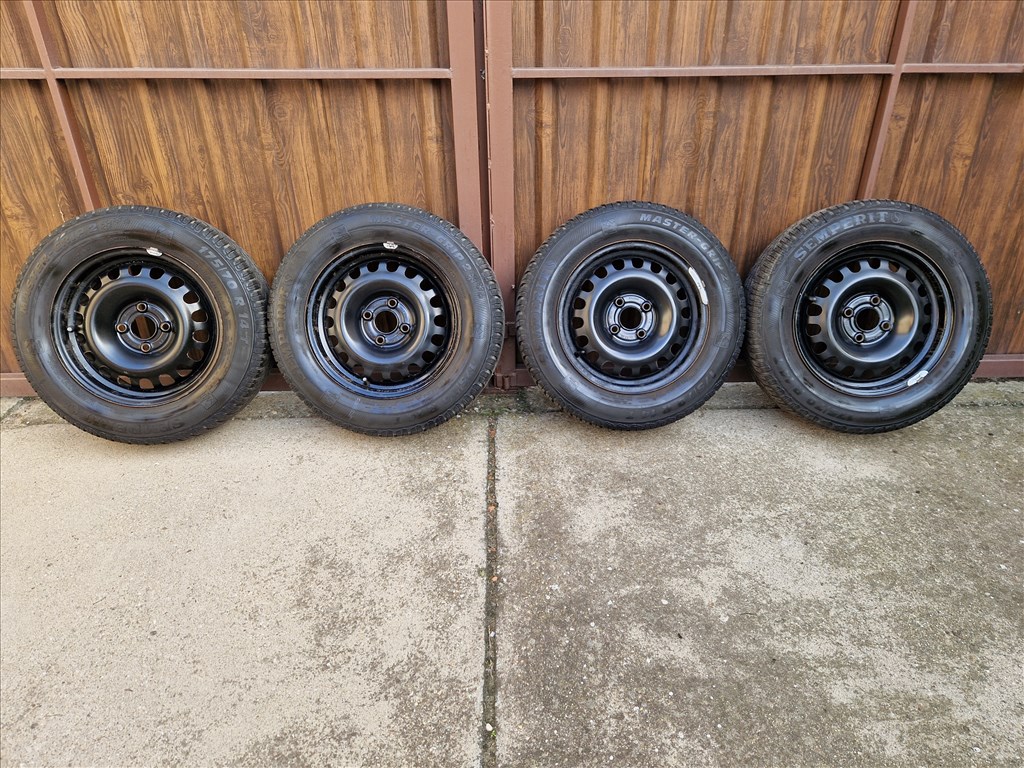  4x100 lyukosztású 14" használt (gyári felni) lemezfelni, rajta 175/70 használt Semperit téli gumi 1. kép
