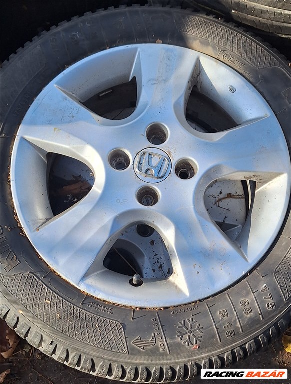  4x100 lyukosztású 15" használt (gyári felni) alufelni, rajta 175/65 használt Kleber téli gumi gumi  1. kép