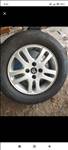  4x108 lyukosztású 15" újszerű (gyári felni) alufelni, rajta 205/65 használt Taurus nyári gumi gumi 