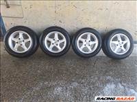  4x108 lyukosztású 14" használt alufelni, rajta 185/65 használt nyári gumi eladó.  Ford Focus