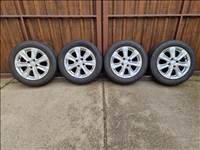  4x100 lyukosztású 15" újszerű Honda (gyári felni) alufelni, rajta 175/65 használt nyári gumi 