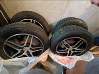  4x100 lyukosztású 15" használt Dezent RB Dark alufelni, rajta 185/60 Fiatal Hankook téli gumi